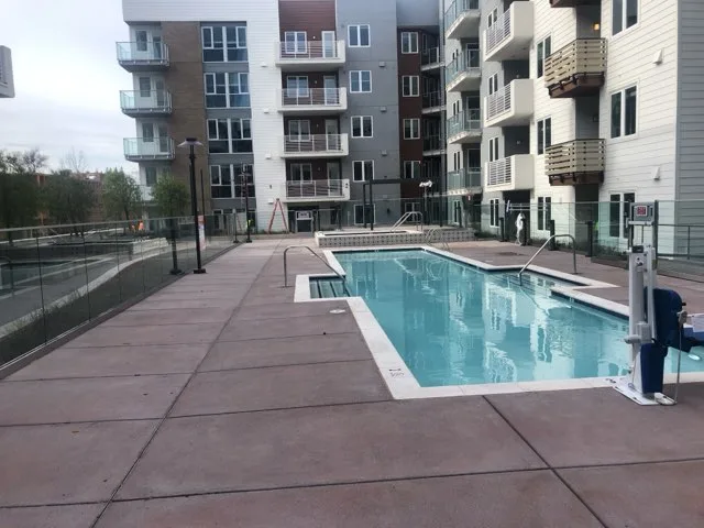 Colored concrete pool deck by Three Rivers Construction