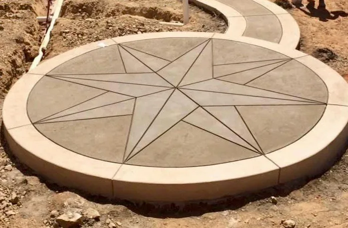 Stamped concrete compass-star medallion and curved walkway